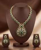 Long necklace set with emerald-inspired green stones, white American Diamond detailing, and matching chandelier earrings.