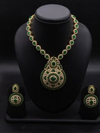 Long necklace set with emerald-inspired green stones, white American Diamond detailing, and matching chandelier earrings.