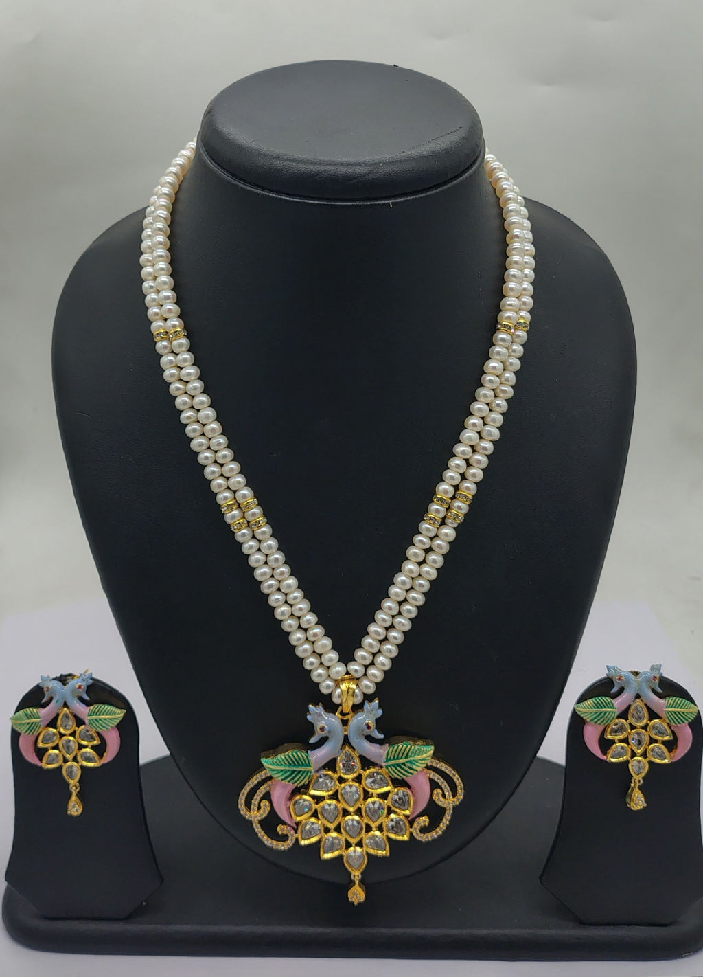 Mayura Pushpanjali two line freshwater pearl pendant necklace set with white flat pearls and peacock motif pendant