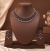 Multicolour American Diamond necklace set with pink and green stones and matching drop earrings.