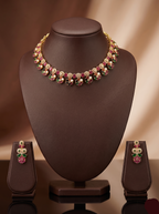 Multicolour stone choker set with red, green, and white stones and matching drop earrings.