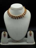 Multicolour stone choker set with red, green, and white stones and matching drop earrings.