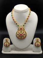 Navaratna multicolour stone necklace set with traditional gold-tone design and matching stud earrings.