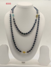 Night Bloom Garland freshwater pearl necklace with black oval pearls and colorful floral beads in layered design