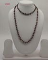 Noir Glow freshwater pearl necklace with black and peacock green pearls in single strand design