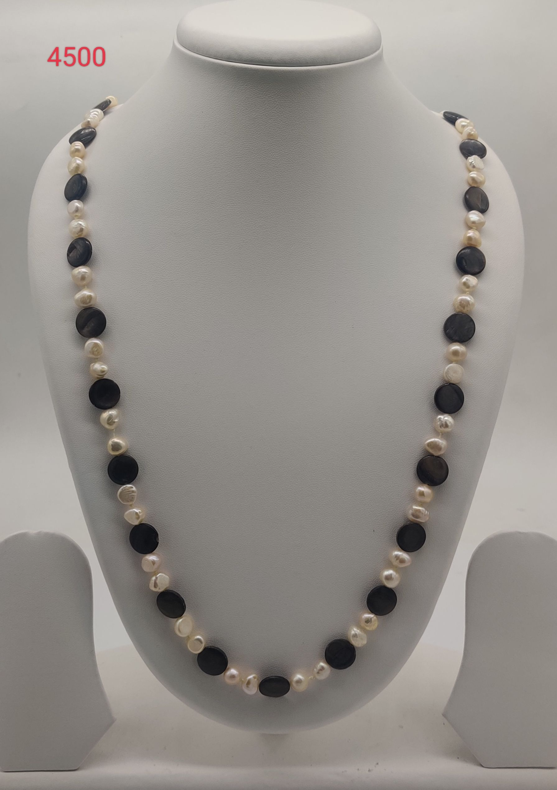 Noir Pearl Balance freshwater pearl necklace set with irregular ivory pearls and flat dark beads in single strand design