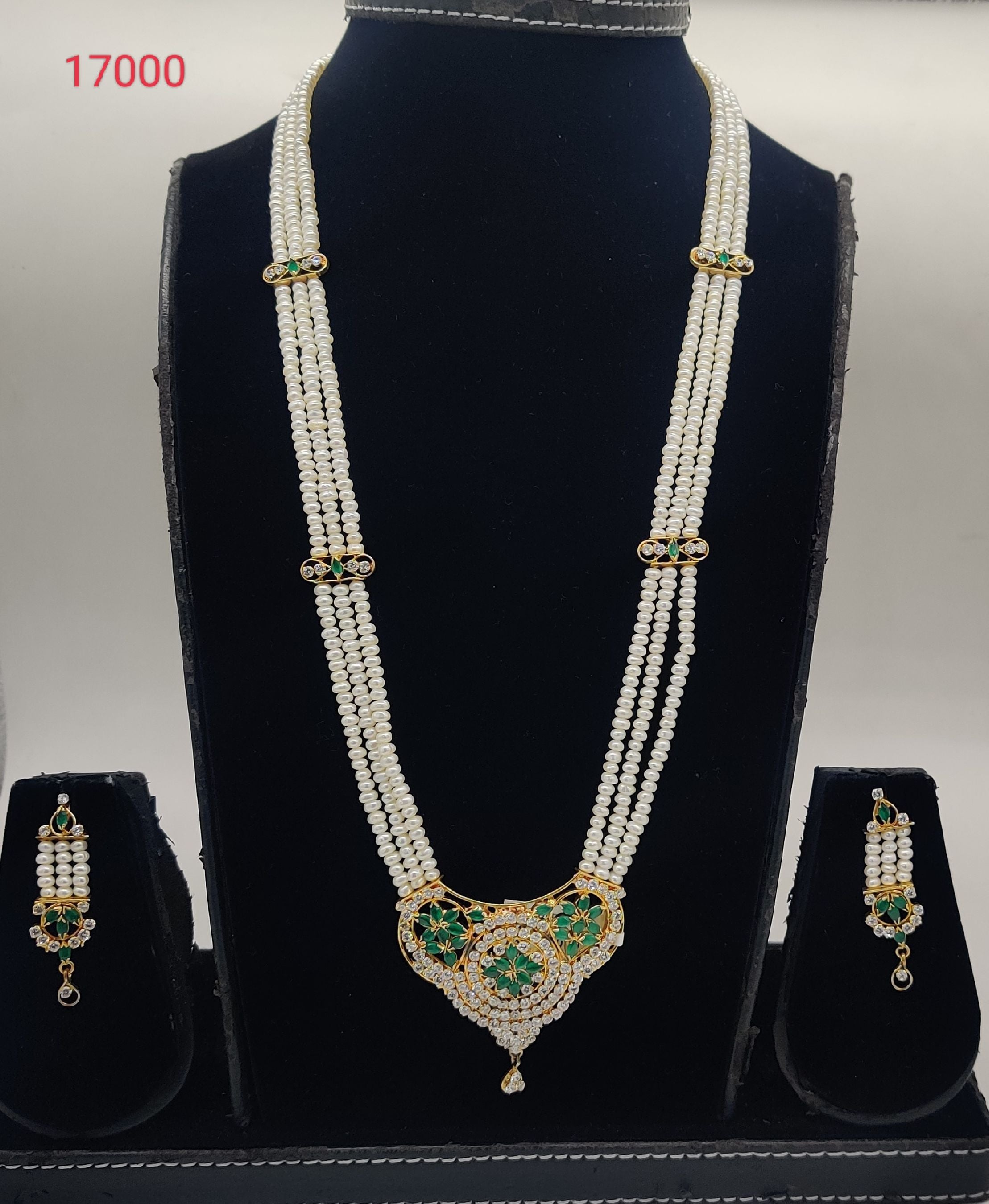 Emerald Opulence three-line flat white freshwater pearl pendent set with green stone pendant and matching earrings
