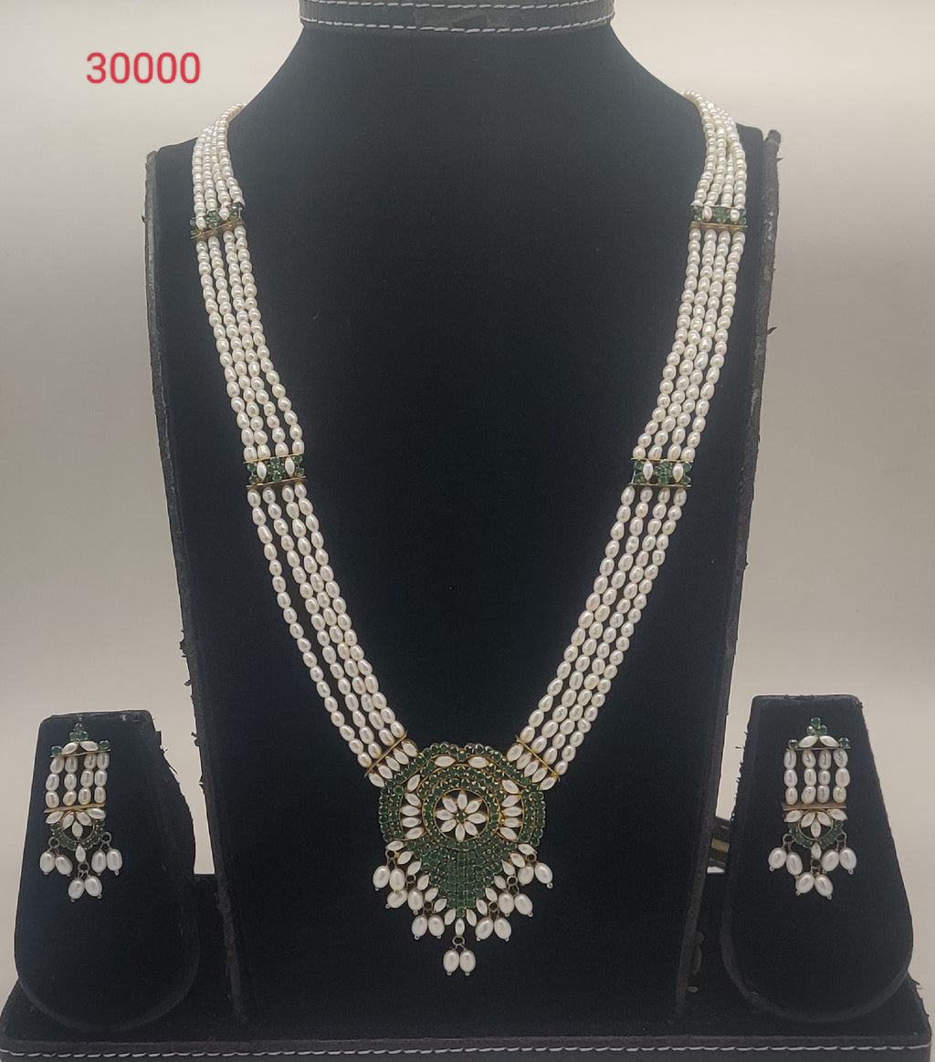 Emerald Serenity Floral four-line oval freshwater pearl pendent set with green stone floral design and matching earrings