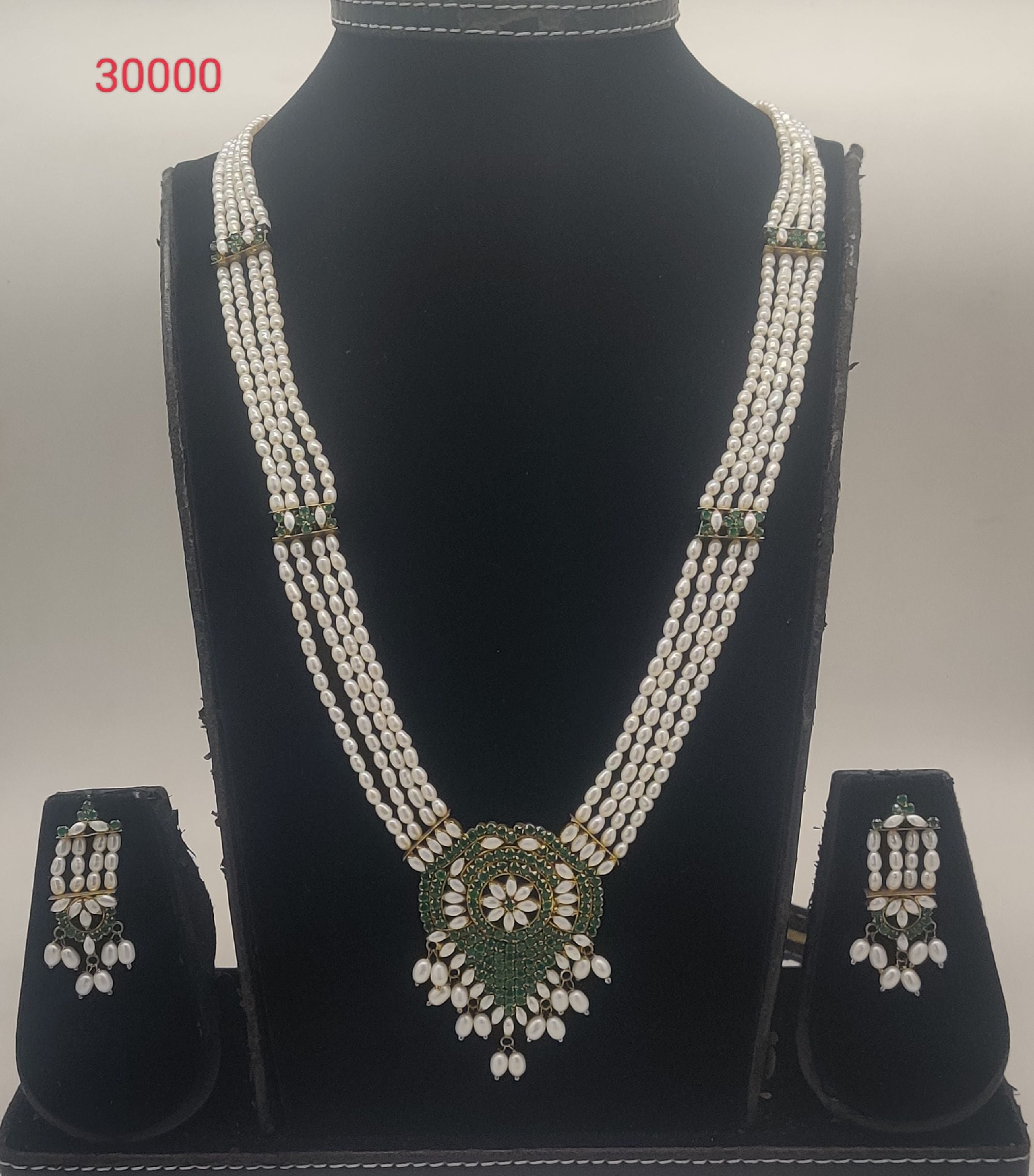 Emerald Serenity Floral four-line oval freshwater pearl pendent set with green stone floral design and matching earrings