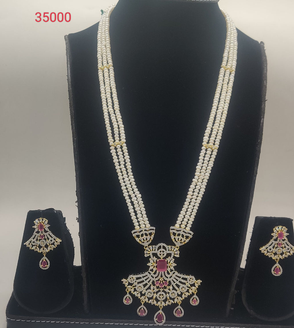 Heritage Ruby Glow long multi-strand freshwater pearl haar pendent set with pink and white stones and matching earrings