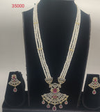 Heritage Ruby Glow long multi-strand freshwater pearl haar pendent set with pink and white stones and matching earrings