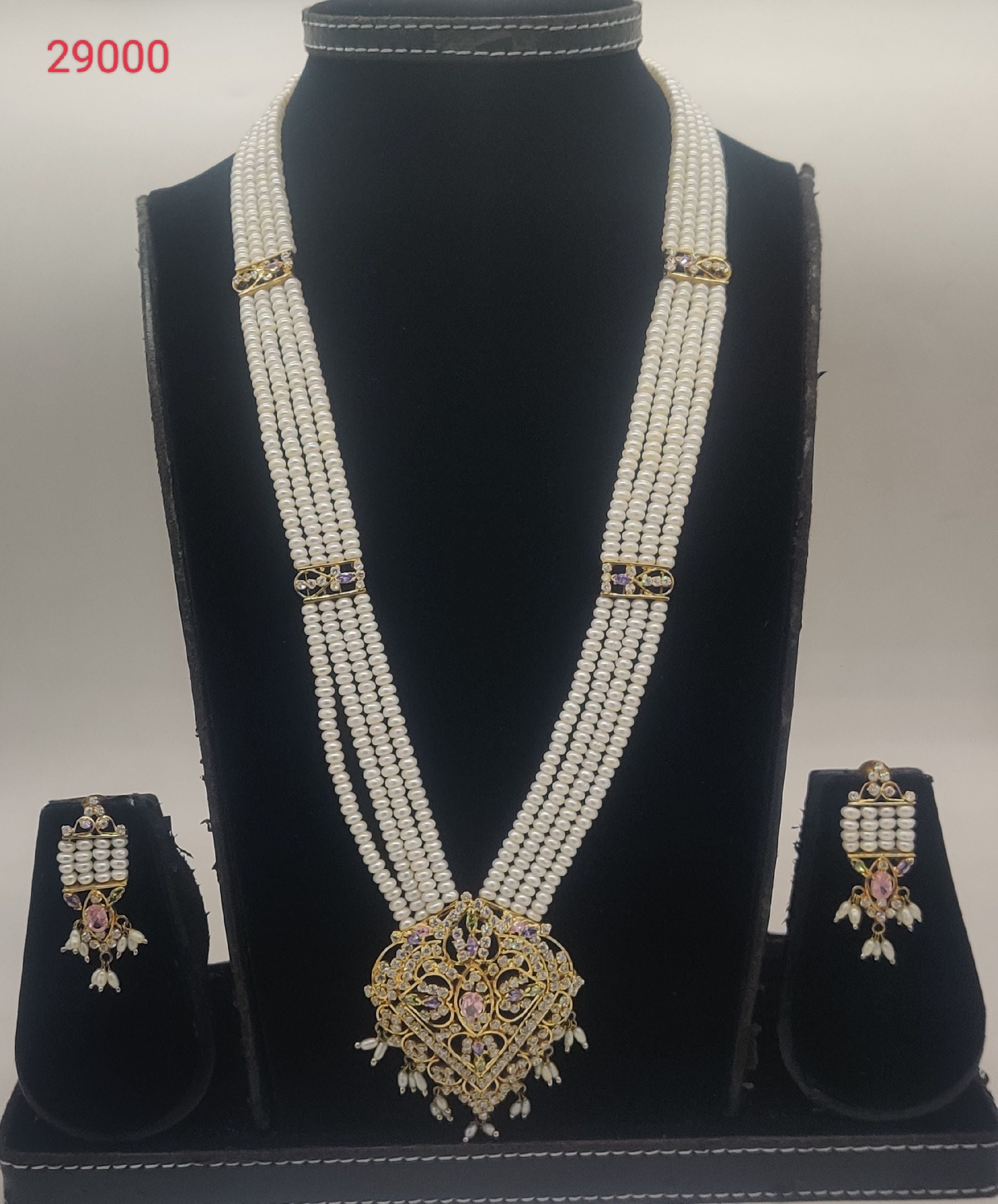 Royal Temple Bloom multi-strand freshwater pearl pendent set with gold temple-style centerpiece and multicolour stones