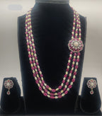 Three-line freshwater pearl and pink stone broach set with floral pendant and matching pearl drop earrings.