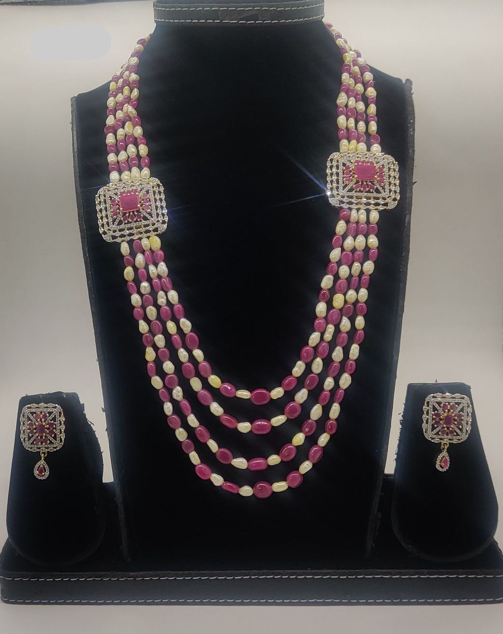 Pink stone and white freshwater pearl multi-line broach set with twin ornate square pendants and matching earrings.