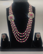 Pink stone and white freshwater pearl multi-line broach set with twin ornate square pendants and matching earrings.