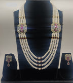 Four-line freshwater pearl broach set with dual rectangular pink and white gemstone pendants and matching drop earrings