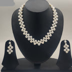 Floral grace double-strand freshwater pearl necklace set with graduated white pearls and matching drop earrings