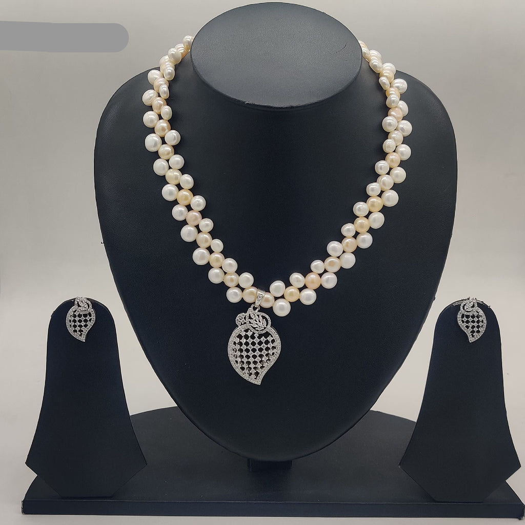 Kundan blossom freshwater pearl double-strand pendant set with red floral kundan design and matching earrings