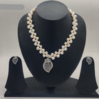 Kundan blossom freshwater pearl double-strand pendant set with red floral kundan design and matching earrings
