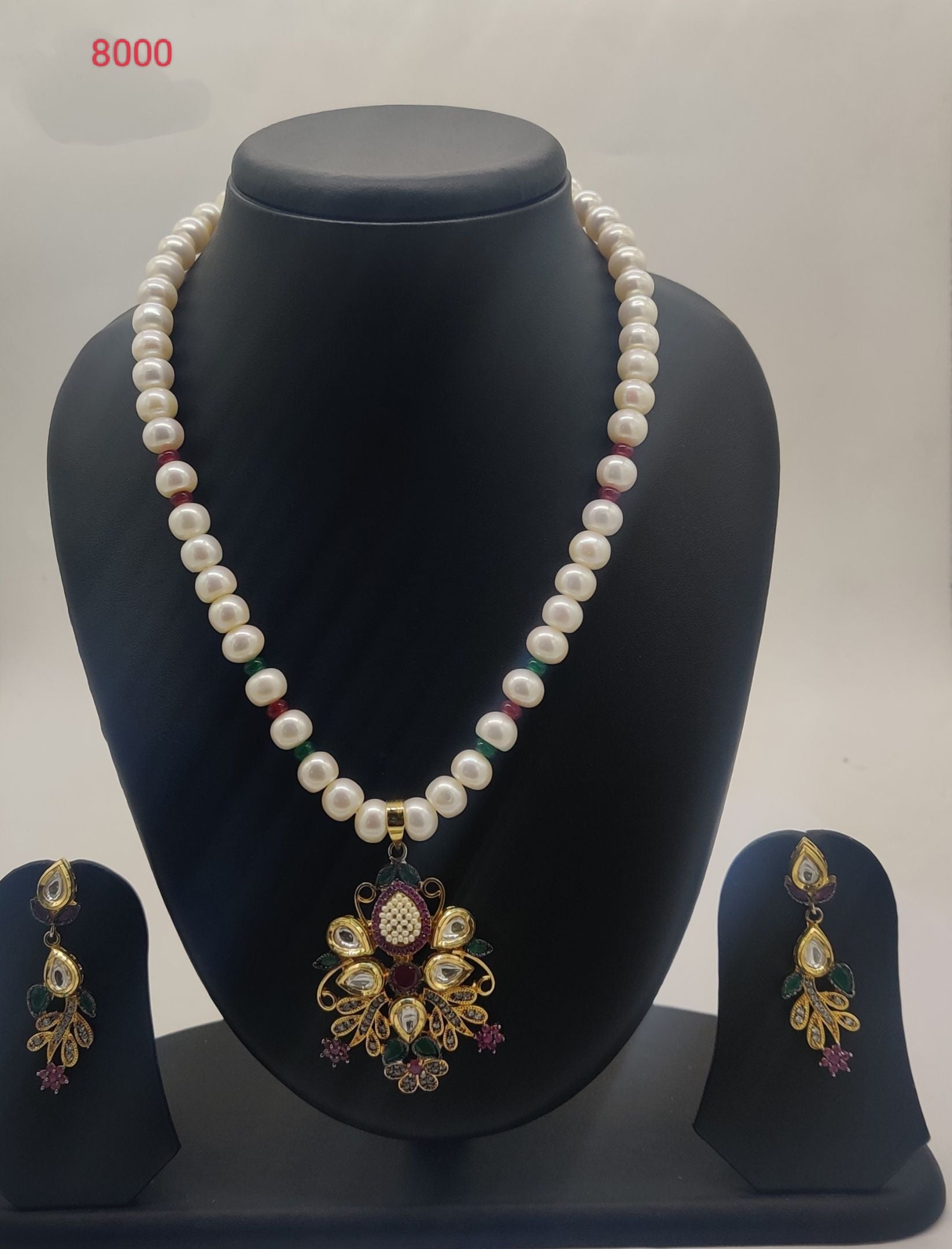 One line freshwater pearl necklace and earrings set with Kundan pendant in white green and pink stones