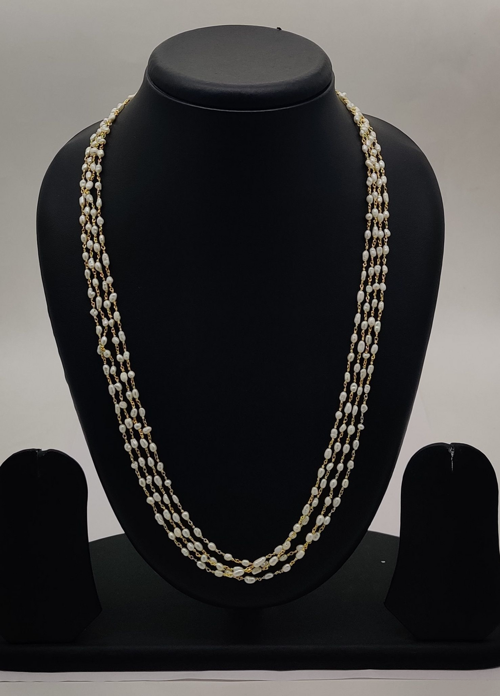 Cascading Gold Glow Multi-Layered Freshwater Pearl Taar Mala with Gold-Tone Detailing
