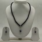 One line freshwater pearl necklace and earrings set with black beads and dark pearl drop pendant