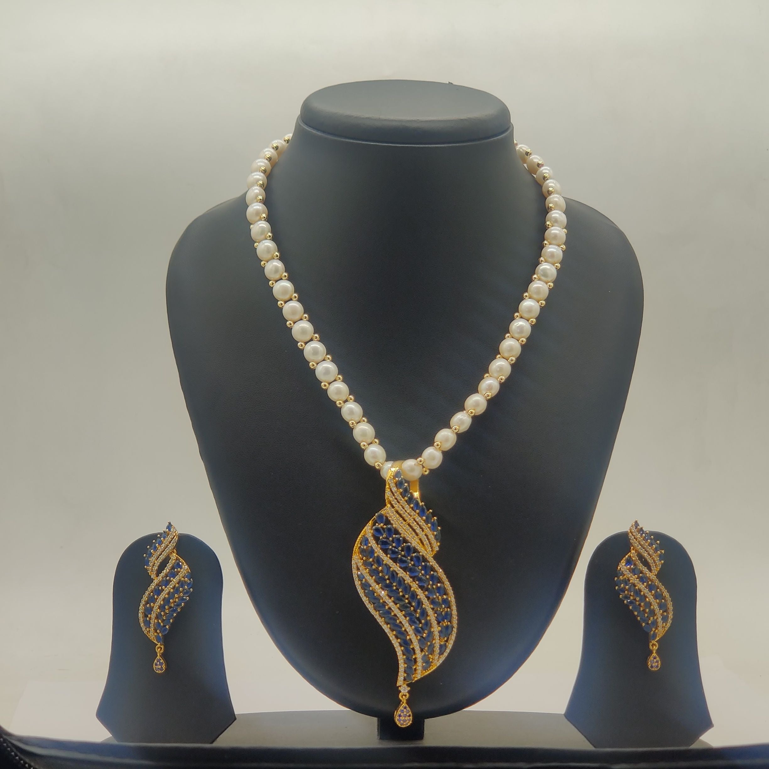 Ocean Leaf freshwater pearls pendant set with blue and white stones and matching earrings for women