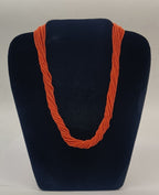 Sunset Twist � Braided Orange Beaded Necklace