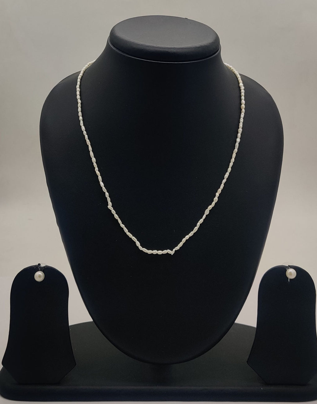 single-strand freshwater rice pearl necklace and stud earrings set for women in natural off white oval pearls