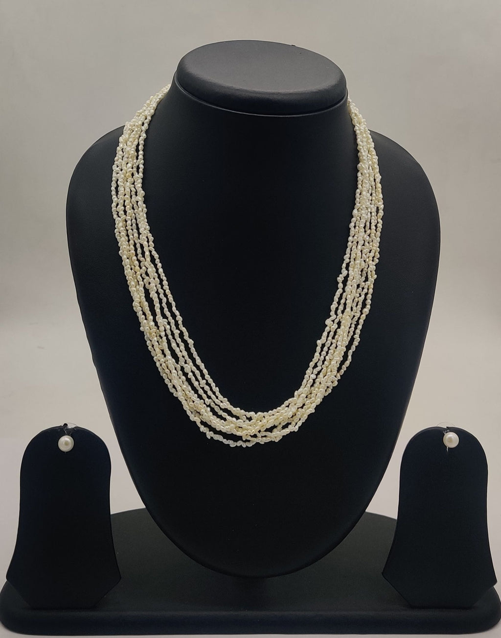 multi-strand twisted freshwater rice pearl necklace and stud earrings set for women in natural off white oval pearls