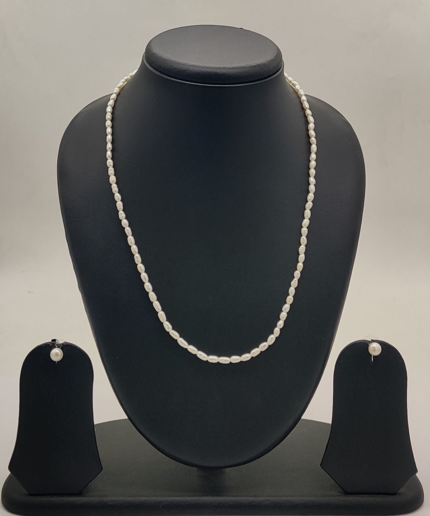 single-strand freshwater rice pearl necklace and stud earrings set for women in natural off white oval pearls