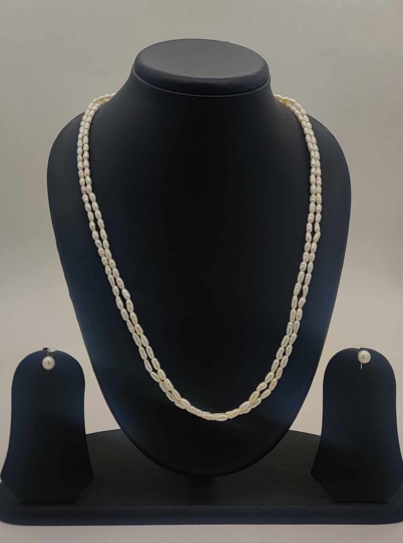 two-strand freshwater rice pearl necklace and stud earrings set for women in natural off white oval pearls