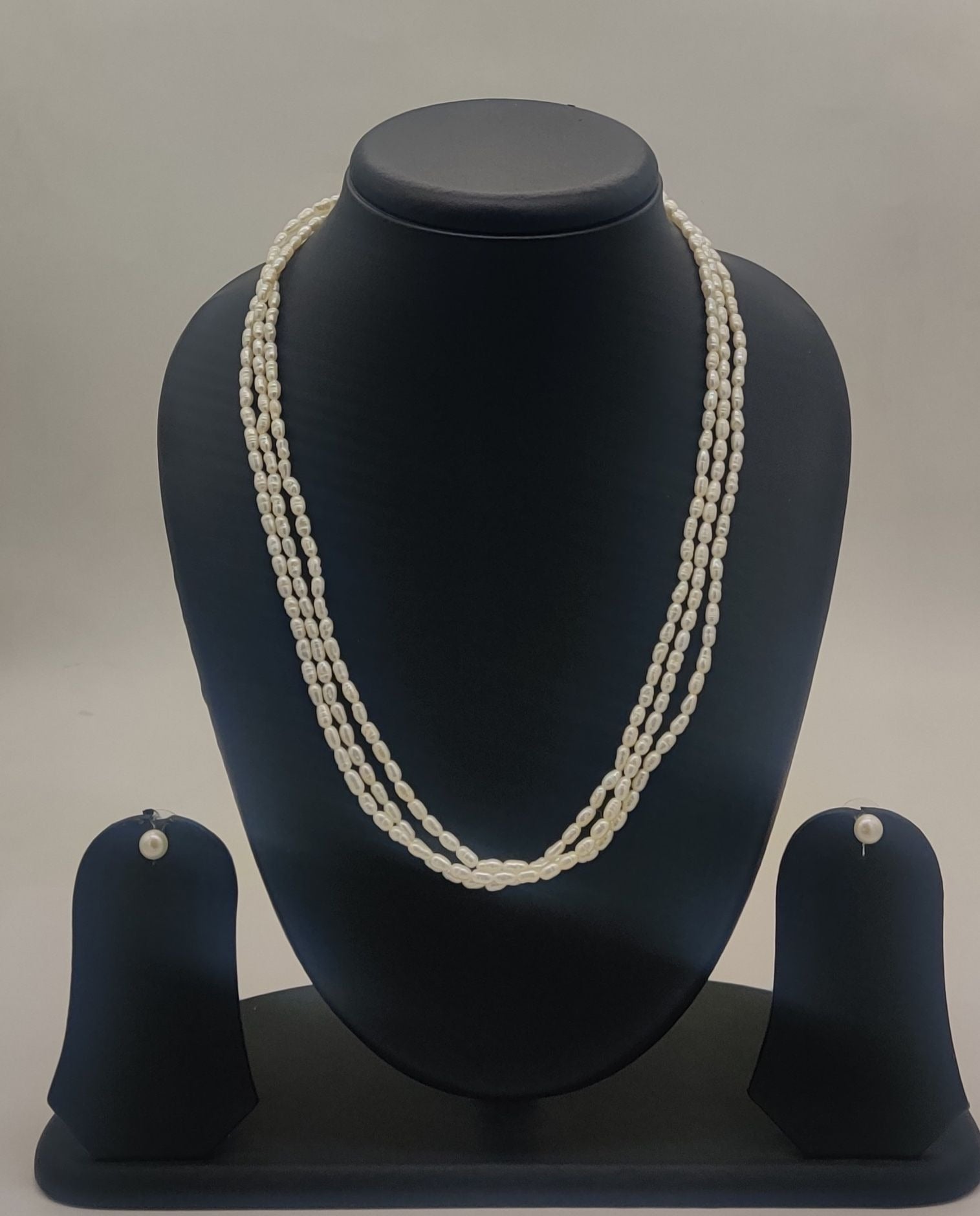three-strand freshwater rice pearl necklace and stud earrings set for women in natural off white oval pearls