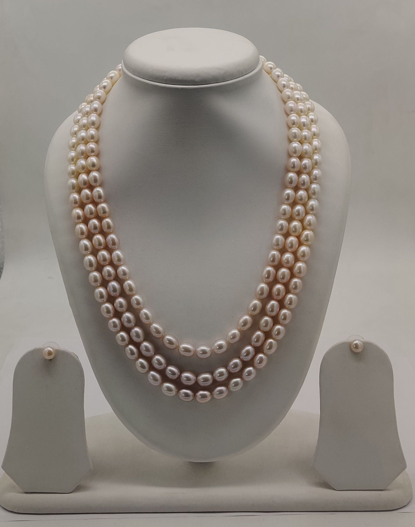 Three-line freshwater pearl necklace and earrings set for women with soft peach pearls