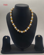 Golden and white single-line freshwater pearl necklace and earrings set for women