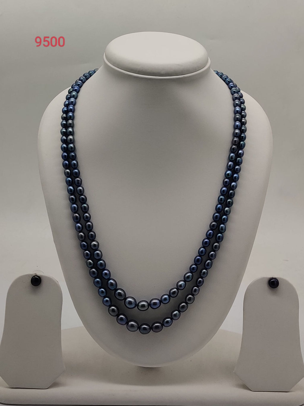 Double strand dark freshwater pearl necklace and earrings set with graduated oval pearls