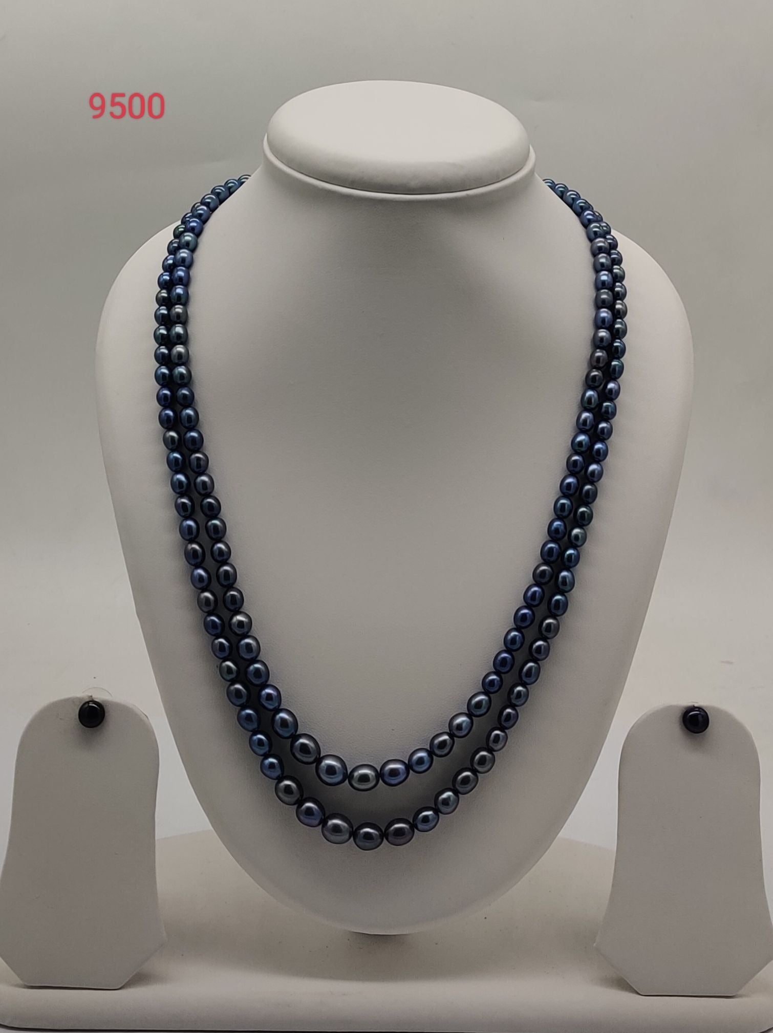 Double strand dark freshwater pearl necklace and earrings set with graduated oval pearls