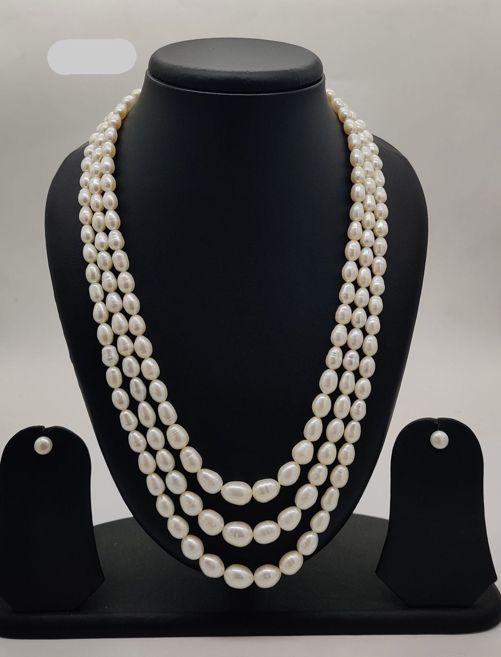 Three-strand freshwater pearl necklace and earrings set for women with oval white pearls