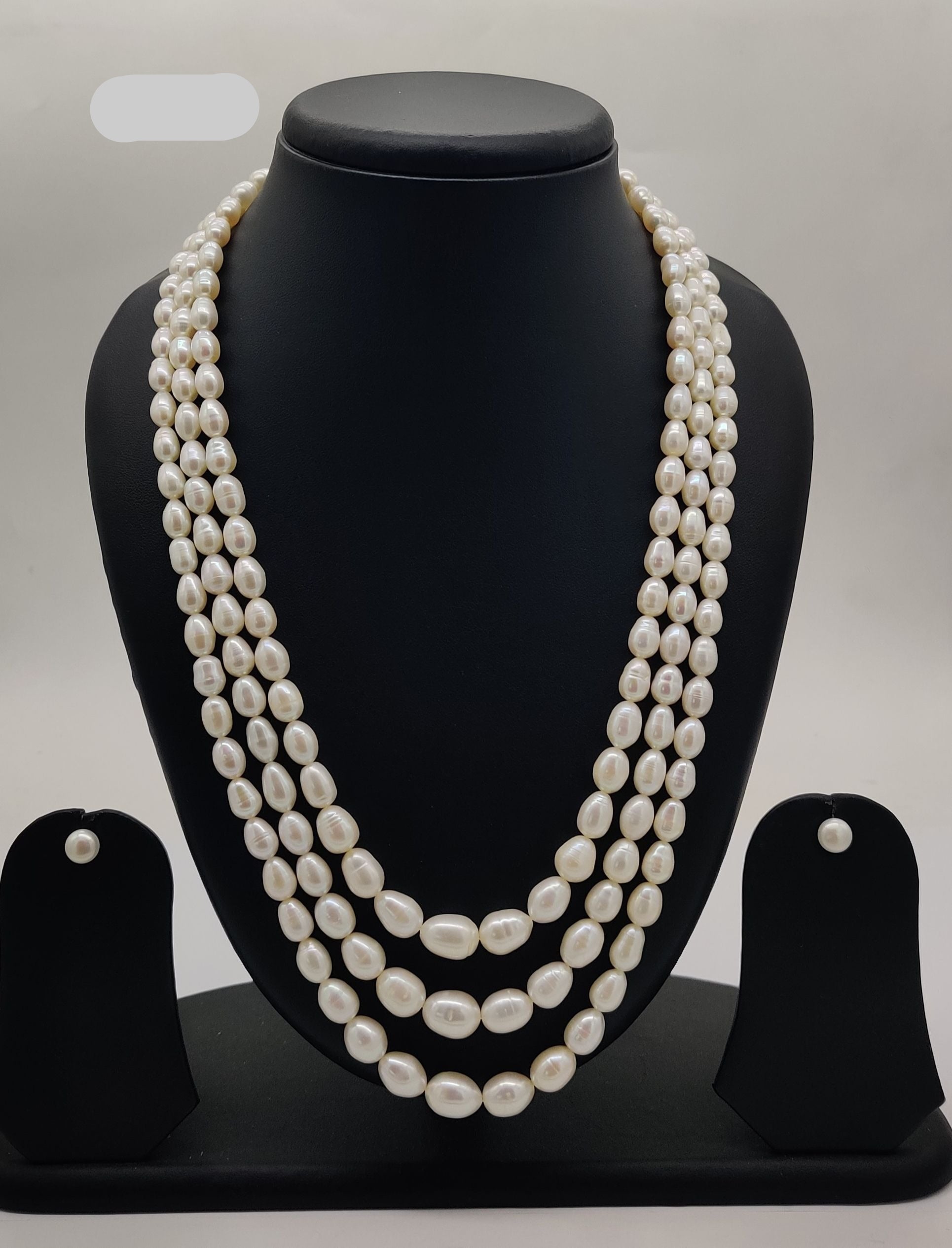 Three-strand freshwater pearl necklace and earrings set for women with oval white pearls