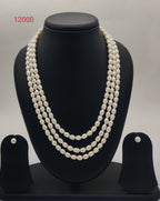 Three-strand freshwater pearl necklace and earrings set for women with oval white pearls