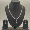 One line freshwater pearl necklace and earrings set with white pearls and central sparkle pearl drop pendant