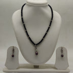 One line freshwater pearl necklace and earrings set with dark pearls gold accents and teardrop pendant