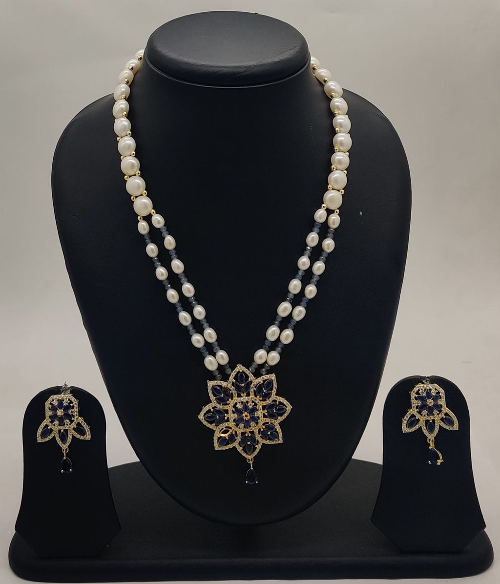 Blue bloom freshwater pearl two-strand pendant set with floral blue and clear stone design and matching earrings
