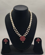 Ruby bloom freshwater pearl double-strand pendant set with red floral gemstone design and matching earrings
