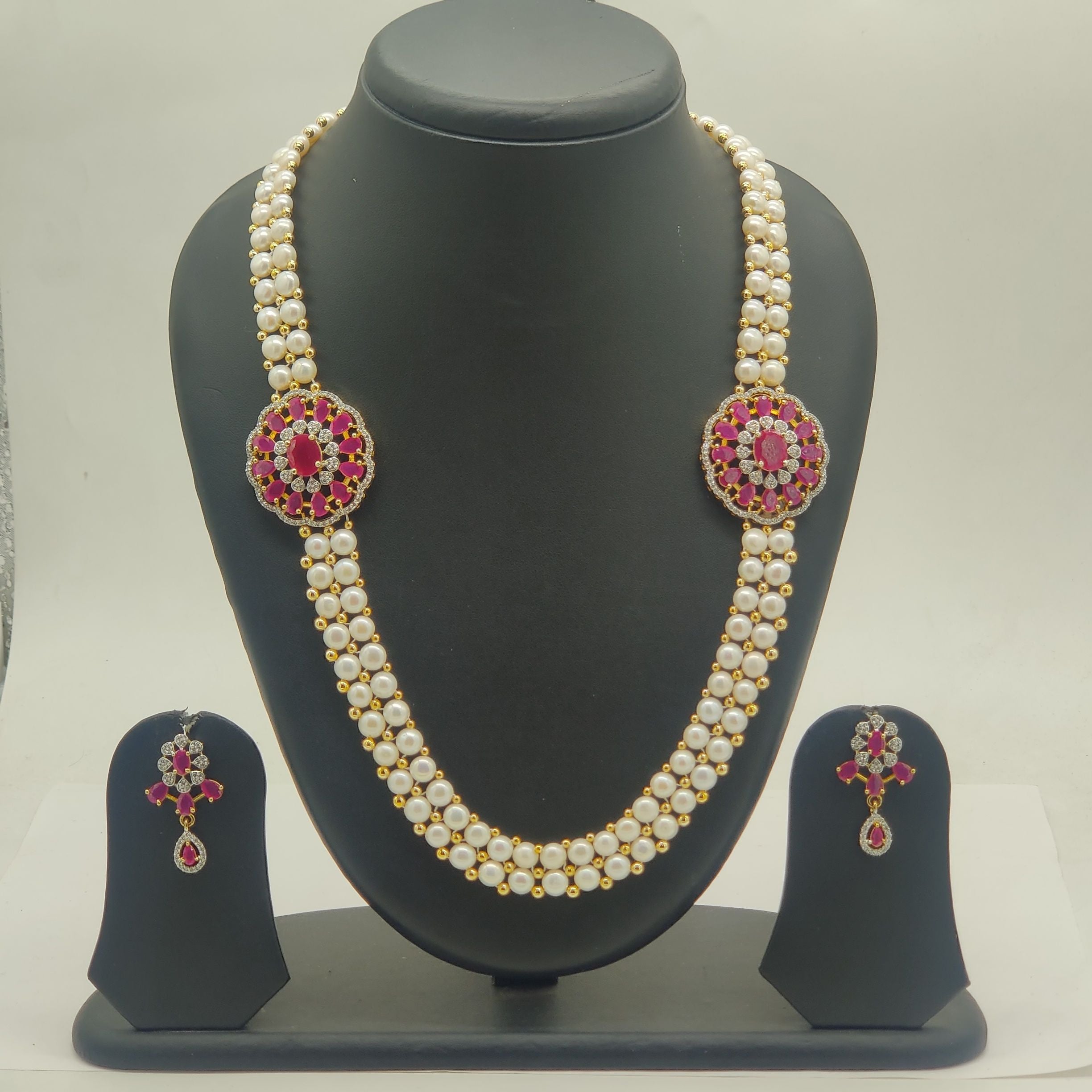 Ruby Blossom Double-Strand Freshwater Pearl Broach Set with Floral Ruby Medallions and Dangling Earrings