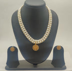 Royal gold freshwater pearl double-strand pendant set with ornate circular medallion and matching stud earrings
