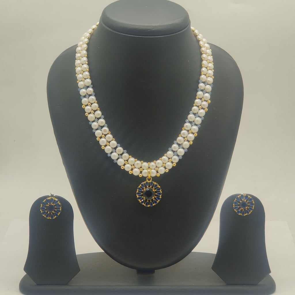 Royal blue multi-strand freshwater pearl necklace set with deep blue circular pendant and matching stud earrings