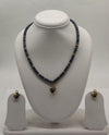 One line freshwater pearl necklace and earrings set with dark beads and heart-shaped pendant