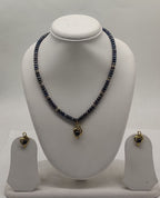 One line freshwater pearl necklace and earrings set with dark beads and heart-shaped pendant