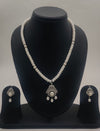 One line freshwater pearl necklace and earrings set with white pearls and silver-toned central pearl drop pendant